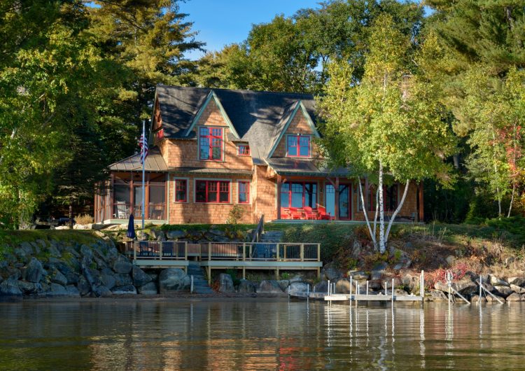 Overlooking the Winnisquam with wonderful breezeway and all wood finish interior
